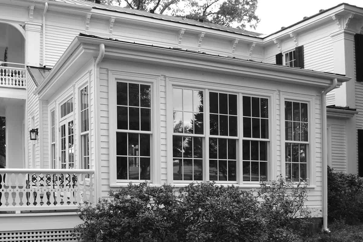 A beautiful sun room addition recently completed by ETL construction for this classic revival home.